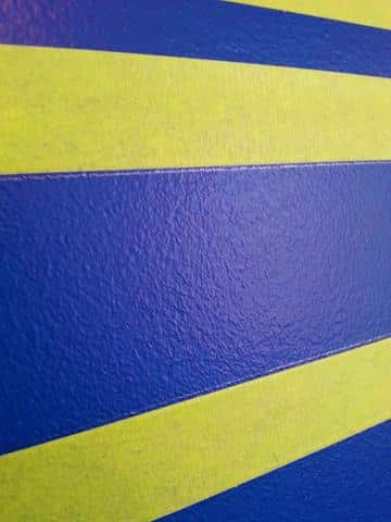 Use painters tape to create stripes on a wall.