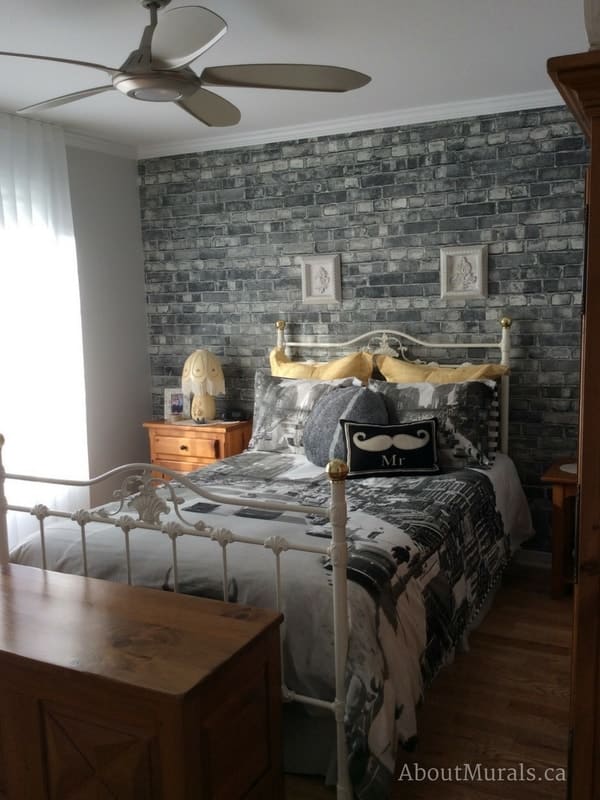 Old Brick Wall Mural Black and White, as seen in this masculine bedroom, is a grey brick wallpaper that creates a rustic, textured feeling to walls. Brick wallpaper sold by AboutMurals.ca.