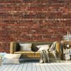 Old Brick Wall Mural, as seen in this living room, is a red brick wallpaper with a textured look. Brick wallpaper sold by AboutMurals.ca.
