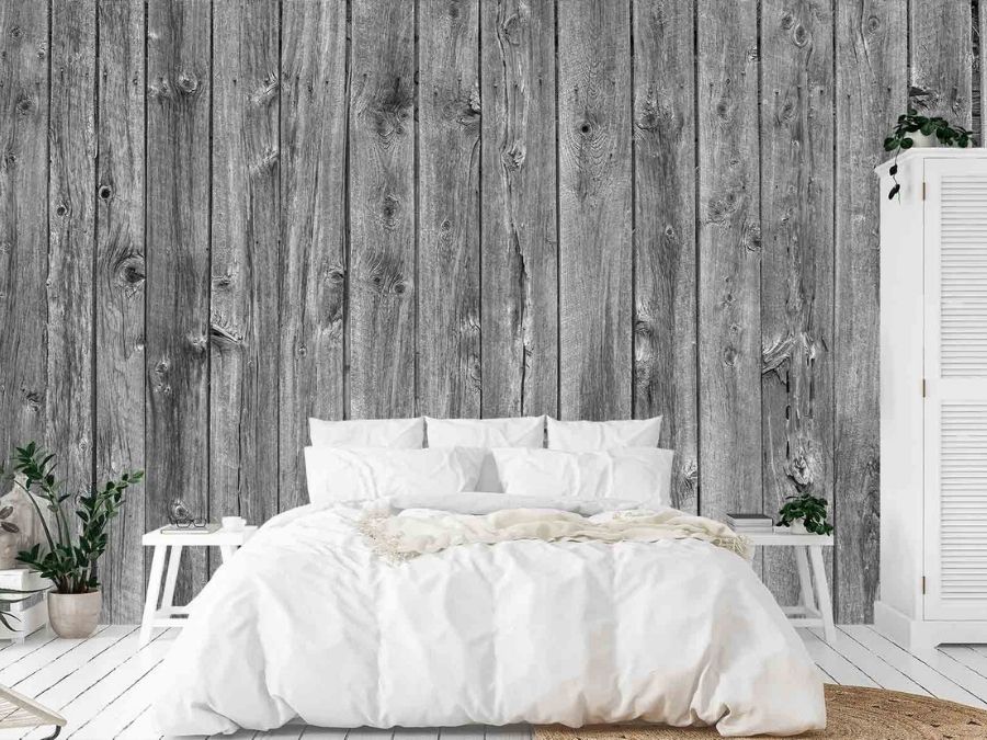 Barn Wood Wall Mural Black and White, as seen on the wall of this grey rustic bedroom, is a wood wallpaper with grey planks from About Murals.