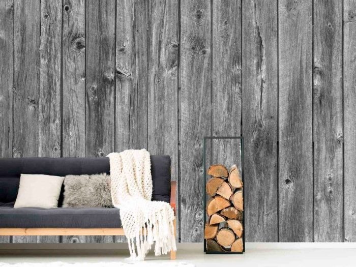 Barn Wood Wall Mural Black and White, as seen in this rustic living room, is a realistic grey wood wallpaper from About Murals.