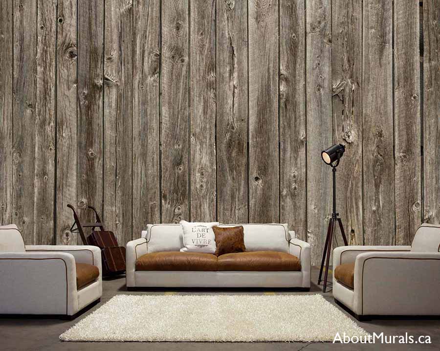 Barn Wood Wallpaper, as seen on the wall of this cozy living room, is a realistic photo mural of brown wooden planks from About Murals.
