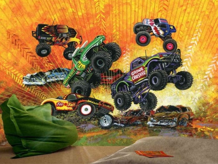 Monster Truck Wallpaper, as seen in this bedroom, is a kids wallpaper of trucks performing freestyle stunts on an orange background, inspired by Monster Jam from About Murals.