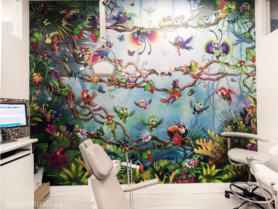 Birds Paradise Wall Mural, as seen in this dentist office, features colorful, cute birds like the toucan and parrot in a tropical jungle. Kids wallpaper sold by AboutMurals.ca.