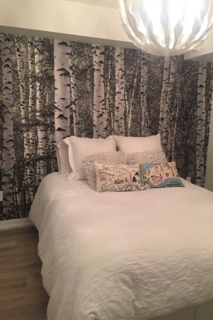 Black and White Birch Tree Wallpaper, as seen on the wall of this white bedroom, is a photo mural with a tree effect in a forest from About Murals.
