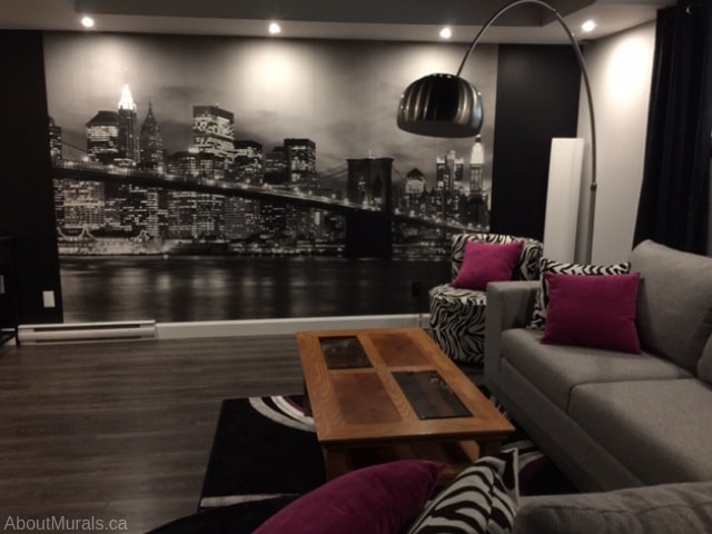 NYC Bridge Wallpaper, as seen in this living room, features a New York City skyline. Removable wallpaper sold by AboutMurals.ca