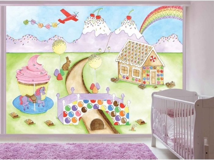 Candy World Wallpaper, as seen on the wall of this nursery, is a candyland full of ice cream mountains, gingerbread house, chocolate river and cupcake carousel from About Murals.