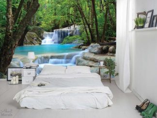 Erawan Waterfalls Wall Mural, as seen on the wall of this bedroom, is a photo wallpaper of aqua blue falls in a Thailand forest from About Murals.