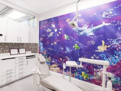 Fish Wall Mural, as seen in this dental office, features fish, turtles, dolphins and sharks swimming in the coral under the blue ocean. Underwater wallpaper sold by AboutMurals.ca.