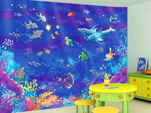 Fish Wall Mural, as seen in this kids room, is an underwater wallpaper featuring fish, sharks, dolphins, turtles and coral from About Murals.
