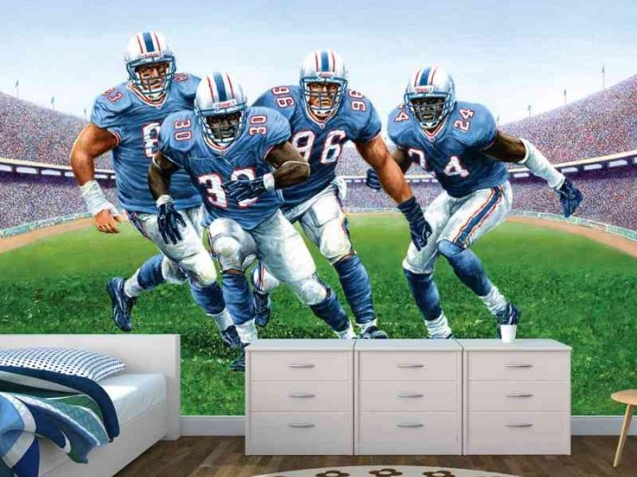 Football Mural, as seen in this football bedroom, features players wearing blue jerseys making a tackling from About Murals.