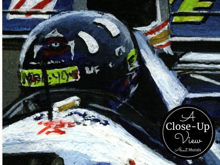 A close-up view of a race car driver in a black helmet in this Grand Prix Wall Mural from About Murals.