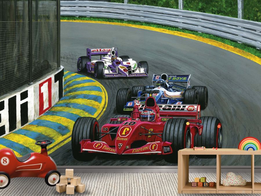 Grand Prix Wall Mural, as seen in this playroom, is a wallpaper featuring three Formula 1 inspired race cars speeding around the corner of a race track from About Murals.