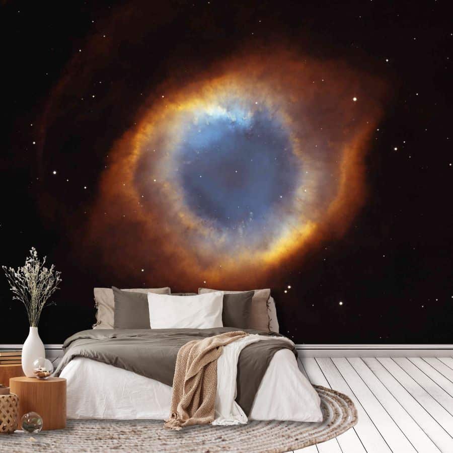 Helix Nebula Wallpaper, as seen on the wall of this bedroom, is a wall mural created from a real NASA image of the NGC7293 nebula surrounded by black space from About Murals.