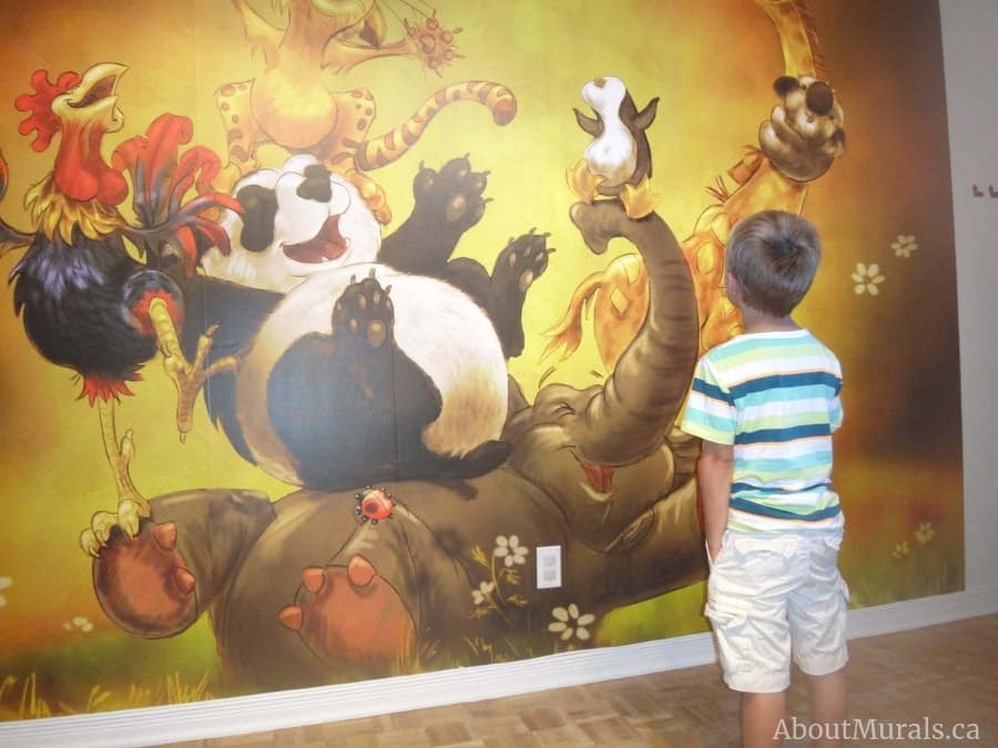 Hoorah Wall Mural, as seen in this kids bedroom, features an elephant, panda bear, giraffe, cat, rooster, penguin and koala all laughing. Animal wallpaper sold by AboutMurals.ca.