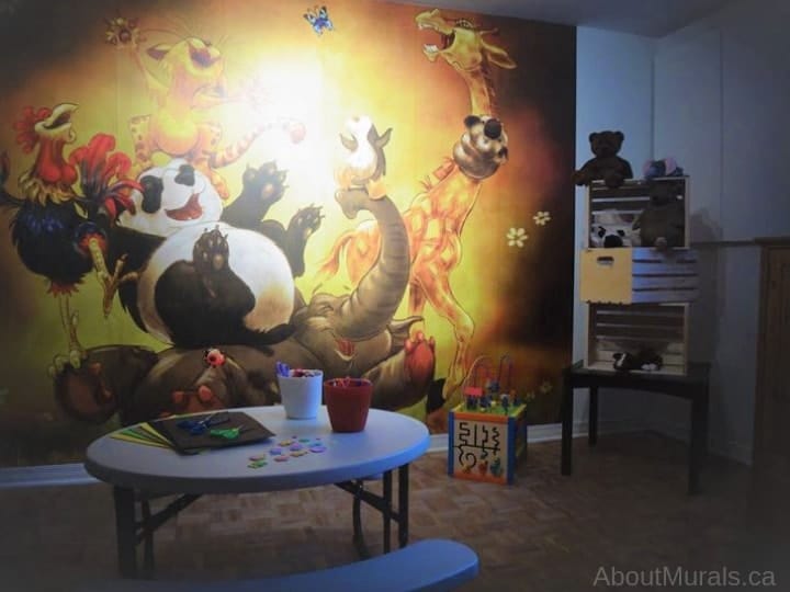 Hoorah Wall Mural, as seen in this playroom, features a giggling elephant, giraffe, panda, koala, penguin, rooster and cat. Animal wallpaper sold by AboutMurals.ca.