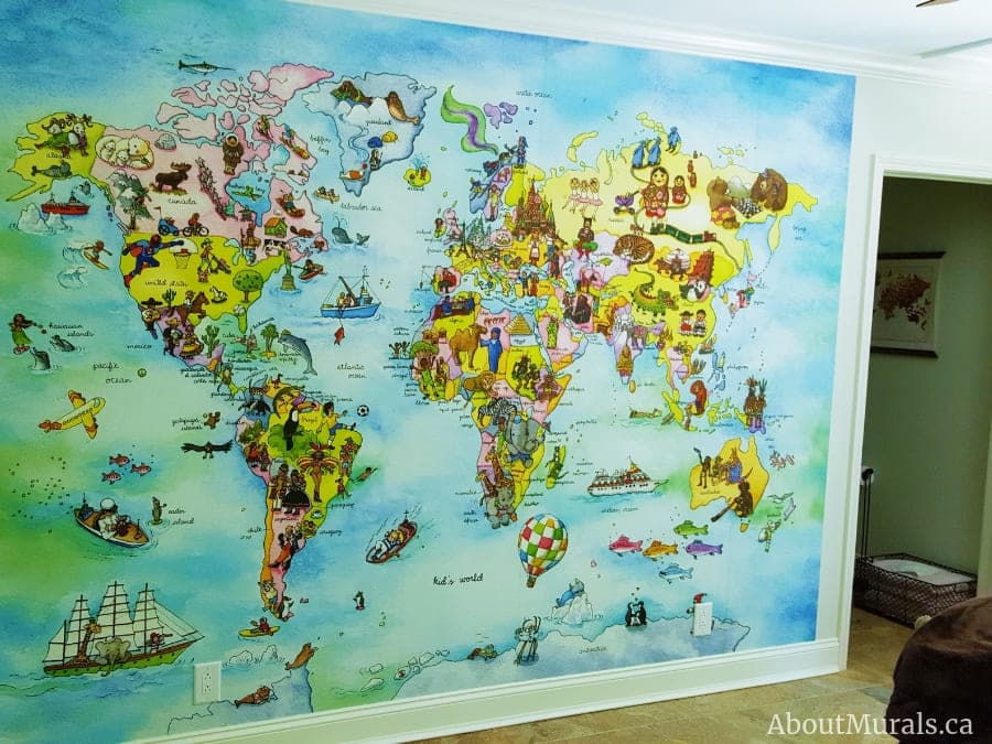 Kids World Map Wall Mural, as seen in this children's bedroom, features the pyramids, Statue of Liberty, Eiffel Tower and other tourist landmarks from around the globe. World map wallpaper sold by AboutMurals.ca.
