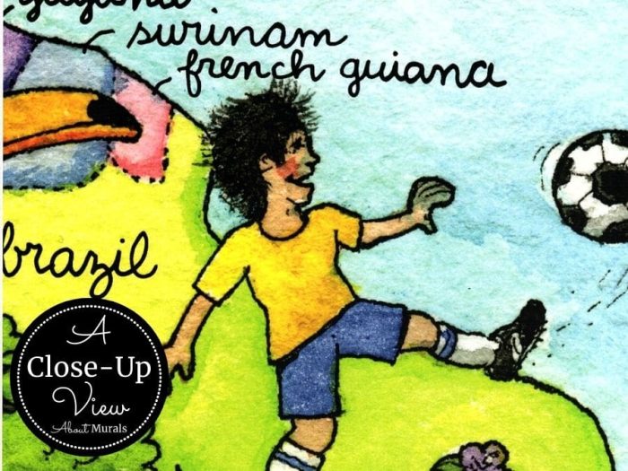 A close-up view of Kids World Map Wall Mural featuring a boy playing soccer in Brazil from About Murals