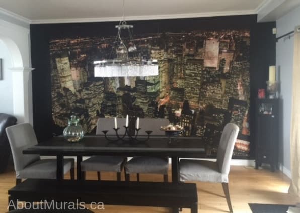 Manhattan at Night Wallpaper, as seen in this dining room, features high rise buildings in New York City. Cityscape wallpaper sold by About Murals.