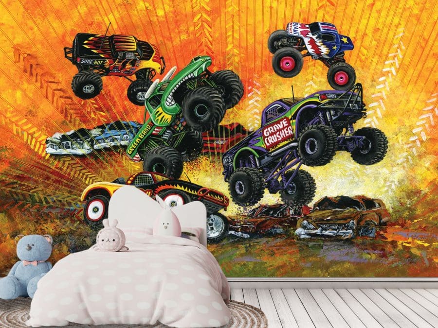 Monster Truck Wallpaper for bedroom is a kids mural of cartoon monster jam trucks in the air with large tires crushing cars on the ground against an orange background from About Murals.