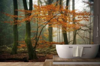 Moody Fall Wallpaper, as seen on the wall of this bathroom, is a photo mural of orange textured trees in a dark forest from About Murals.