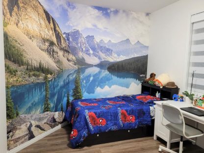 Moraine Lake Wallpaper, as seen on the wall of this kids bedroom, is a high resolution photo wall mural of a sunset on Canadian mountains in Alberta from About Murals.