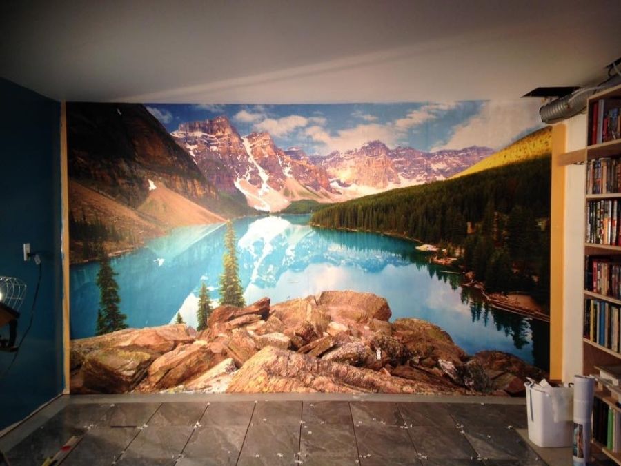 Moraine Lake Wallpaper, as seen on the wall of this room, is a photo wall mural of a beautiful Canadian mountain landscape from About Murals.