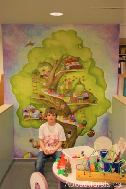My Tree House Wall Mural, as seen in this hospital, features kids playing in a treehouse. Kids wallpaper sold by AboutMurals.ca.