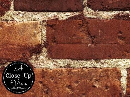 A close-up view of a red brick wallpaper called Not Just Another Brick on the Wall Mural from About Murals