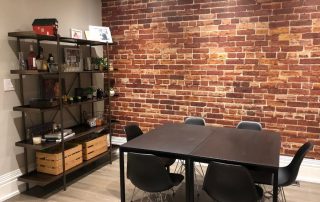 Not Just Another Brick on the Wall Mural, as seen in this dining room, is a brick wallpaper from About Murals.