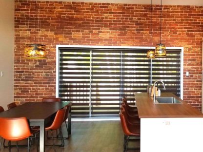 Orange Brick Wallpaper, as seen on the wall of this dining room, is a realistic brick effect mural with tons of texture from About Murals.