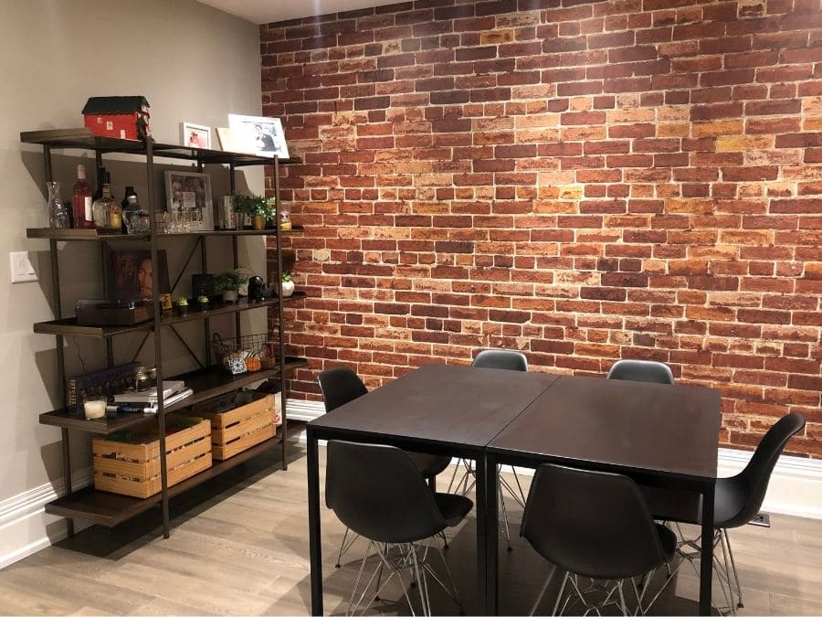 Orange Brick Wallpaper, as seen on the wall of this kitchen, is a high resolution photo mural of a vintage red brick wall from About Murals.