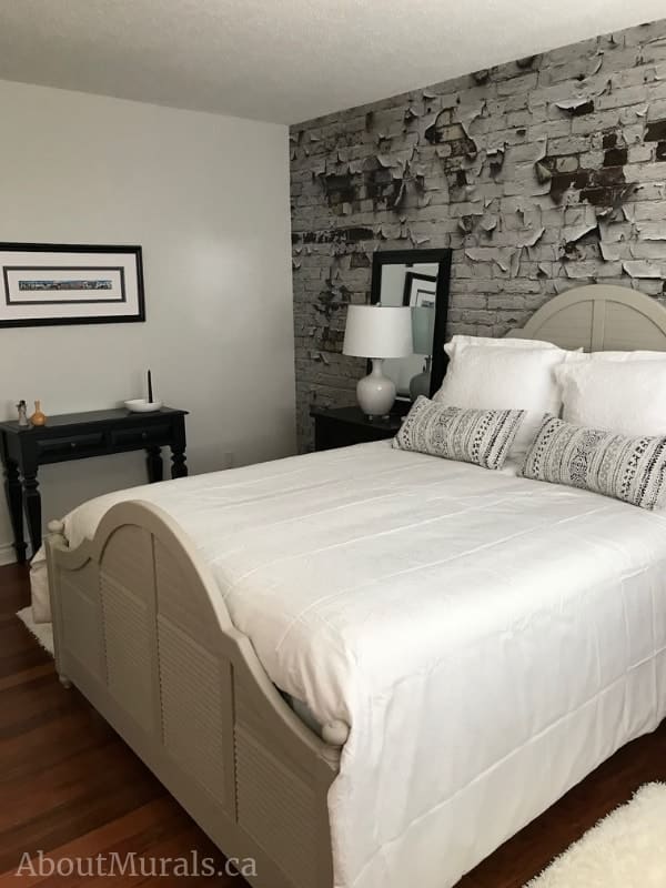Peeling Paint Brick Wallpaper, as seen in this white bedroom, creates a textured, almost 3D look on walls. Distressed brick wallpaper sold by AboutMurals.ca.