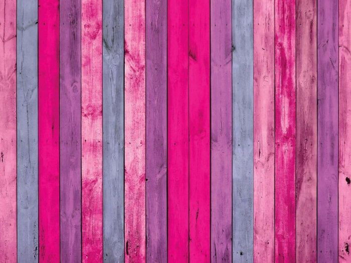 Pink Wood Wallpaper for walls features purple and pink wooden planks from About Murals.