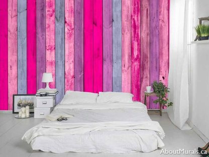 Pink Wood Wallpaper, as seen on the wall of this bedroom, features textured looking pink and purple wooden boards from About Murals.