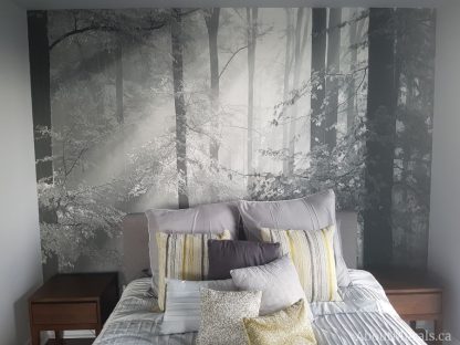 Sinfonia Della Foresta Black and White Wall Mural, as seen in this bedroom, feels tranquil as rays of sunshine peer through trees in a forest. Forest wallpaper sold by AboutMurals.ca.