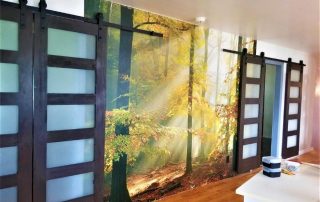 Sinfonia Della Foresta Wall Mural, as seen in this room, features yellow fall trees in an enchanted forest. Forest wallpaper sold by AboutMurals.ca.