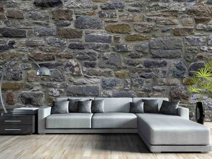 Stone Wall Mural, as seen in this living room, is a photo wallpaper of textured stones from About Murals.