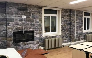 Stone Wall Mural, as seen in this TV Room, is a photo wallpaper of a real grey stones from About Murals.