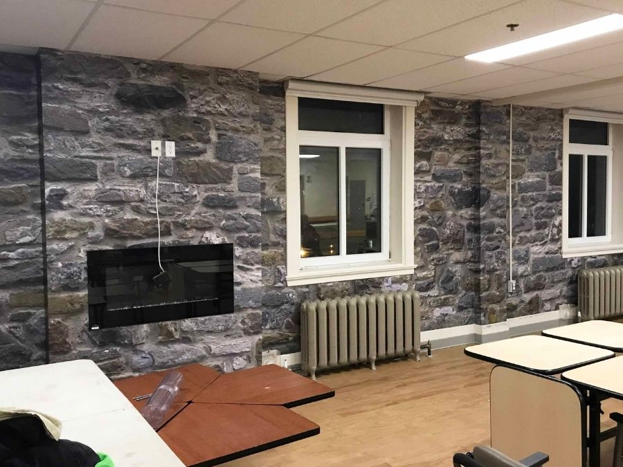 Stone Wall Mural, as seen in this TV Room, is a photo wallpaper of a real grey stones from About Murals.