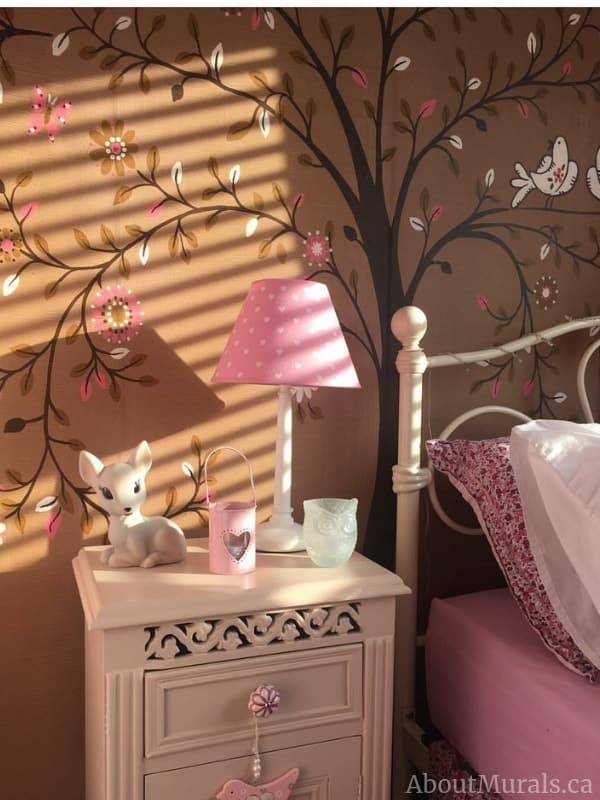 Tree of Life Brown Wall Mural, as seen in this pink and brown bedroom, features a whimsical tree with flowers, leaves, butterflies and birds. Kids wallpaper sold by AboutMurals.ca.