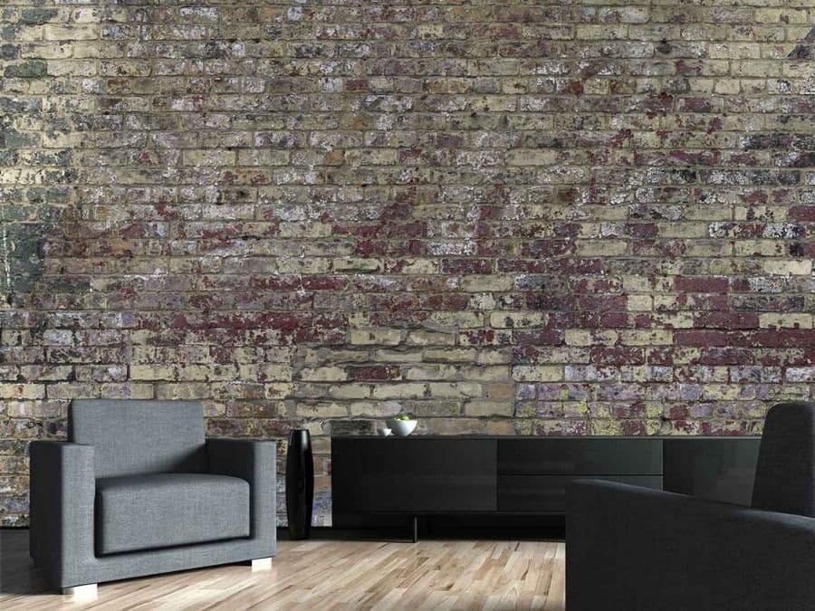 Vintage Brick Wallpaper, as seen on the wall of this living room, is a photo mural of decaying red faux brick from About Murals.