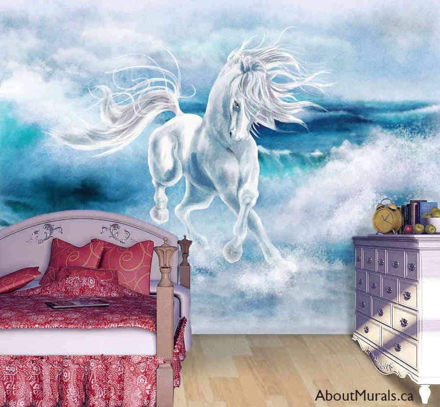 Wave Dancer Wall Mural, as seen on the wall of this bedroom, is a horse wallpaper of a white horse running through blue waves from About Murals.