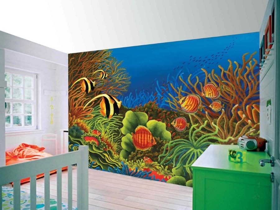 Wonders of the Ocean Wall Mural, as seen in this bedroom, is an underwater wallpaper with fish and coral in the blue ocean from About Murals.