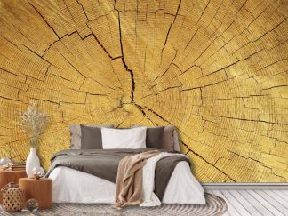Wood Slab Wallpaper, as seen on the wall of this rustic bedroom, is a photo mural of a round log wood slice full of realistic texture from About Murals.