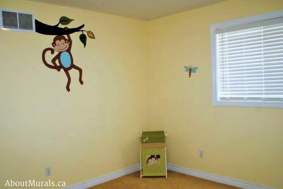 A rainforest mural featuring a monkey hanging from a vent in a girl's bedroom, painted by Adrienne of AboutMurals.ca