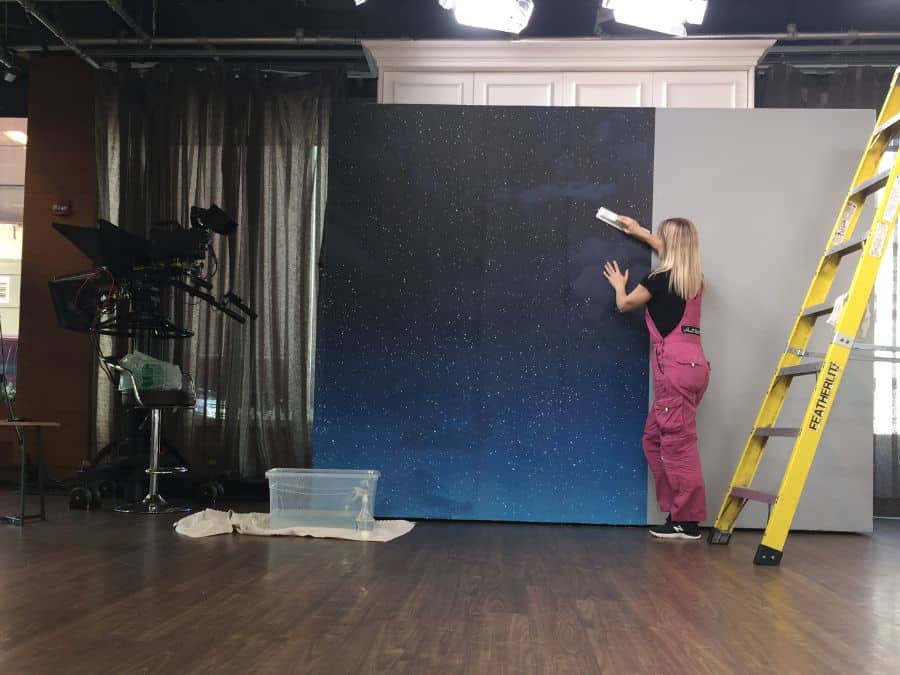 Wall Mural Installation, as seen with this starry sky wallpaper mural on set at Cityline, is a service offered by About Murals in Hamilton, Ontario.