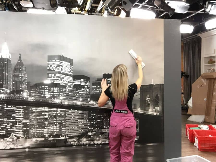 Wall Mural Installation, as seen with this cityscape wallpaper mural on set at Cityline in Toronto, is a service offered by About Murals.
