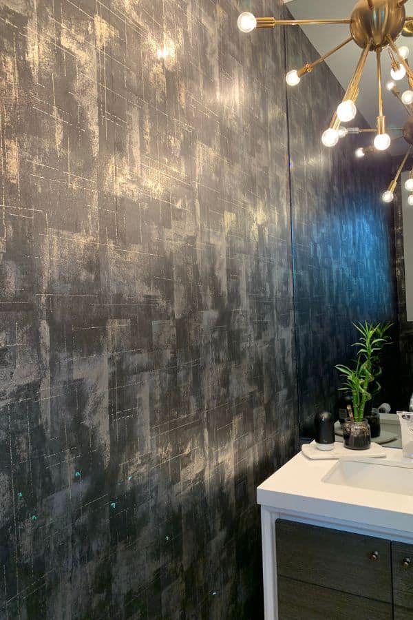Wallpaper Installer Hamilton, whose work is seen in this dark powder room, hangs most types of wallcoverings. Learn more about wallpaper installation at AboutMurals.ca.