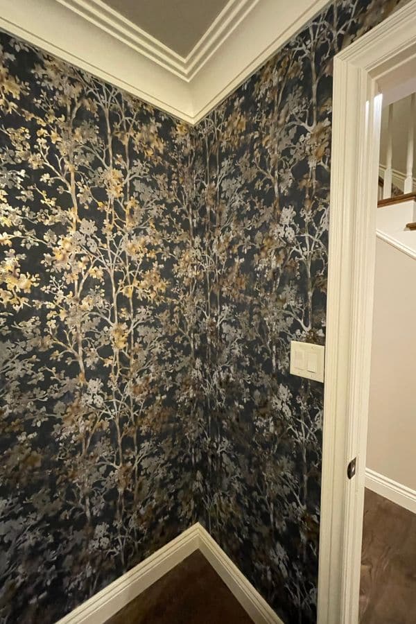 Wallpaper Installer Toronto, whose work is seen in this dark powder room, hangs most types of wallcoverings. Learn more at AboutMurals.ca.